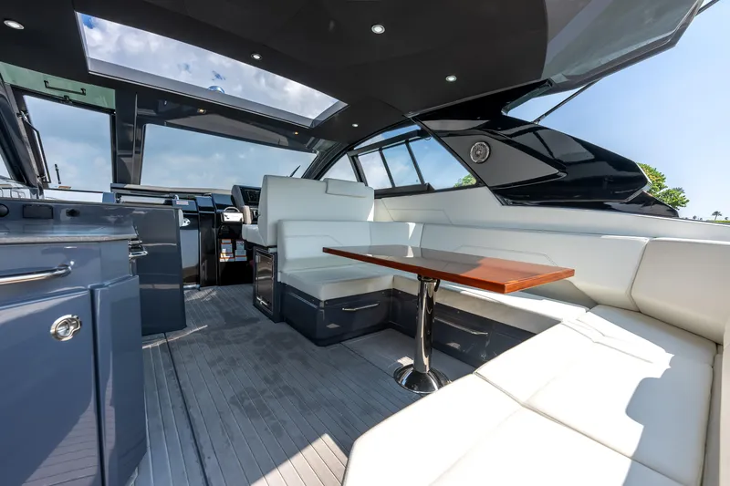 Slide: The Image of Luxurious interior of 2023 Cruisers Yachts 42 GLS OB with sleek seating and modern design. - 39