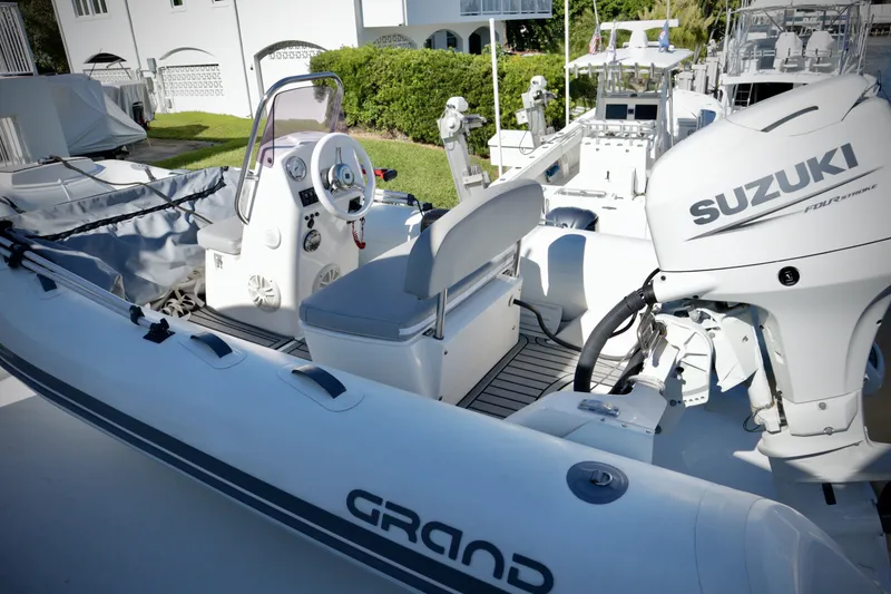 Slide: The Image of Inflatable boat with Suzuki motor on a 2003 Hatteras 6300 Motor Yacht. - 28
