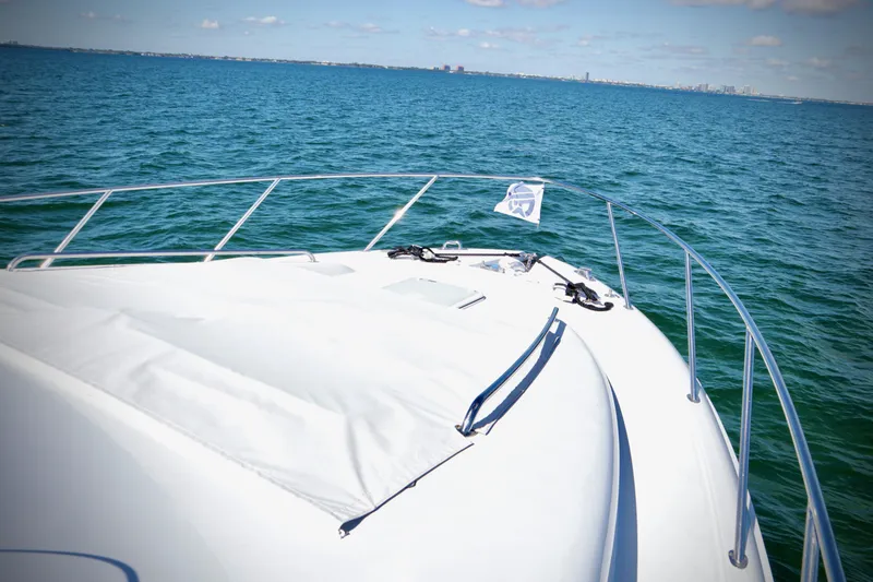 Slide: The Image of Bow view of 2003 Hatteras 6300 Motor Yacht on open water. - 7