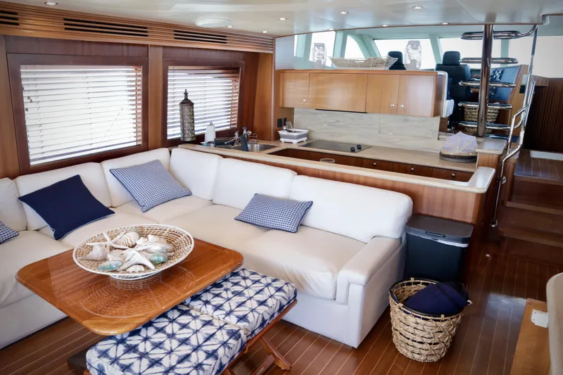 Slide: The Image of Luxurious interior of 2003 Hatteras 6300 Motor Yacht with elegant seating and decor. - 9