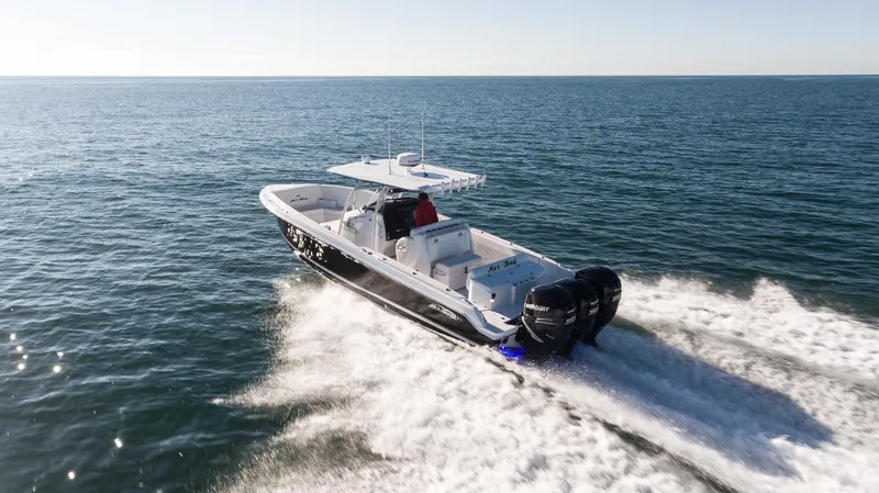 Slide: The Image of 2025 Nor-Tech 340 boat cruising on open water. - 12