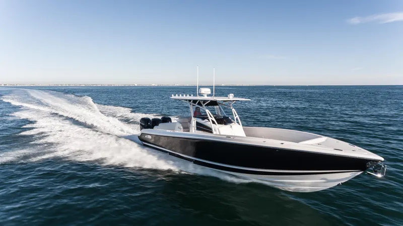 Slide: The Image of 2025 Nor-Tech 340 boat cruising on open water, showcasing sleek design and performance. - 16