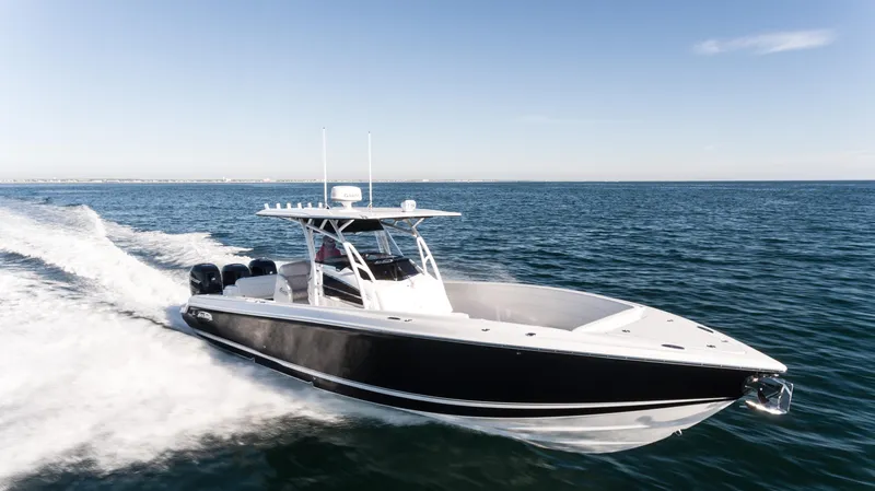 Slide: The Image of 2025 Nor-Tech 340 boat cruising on open water, showcasing sleek design and powerful performance. - 18