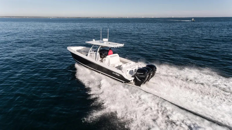 Slide: The Image of 2025 Nor-Tech 340 boat cruising on open water. - 22