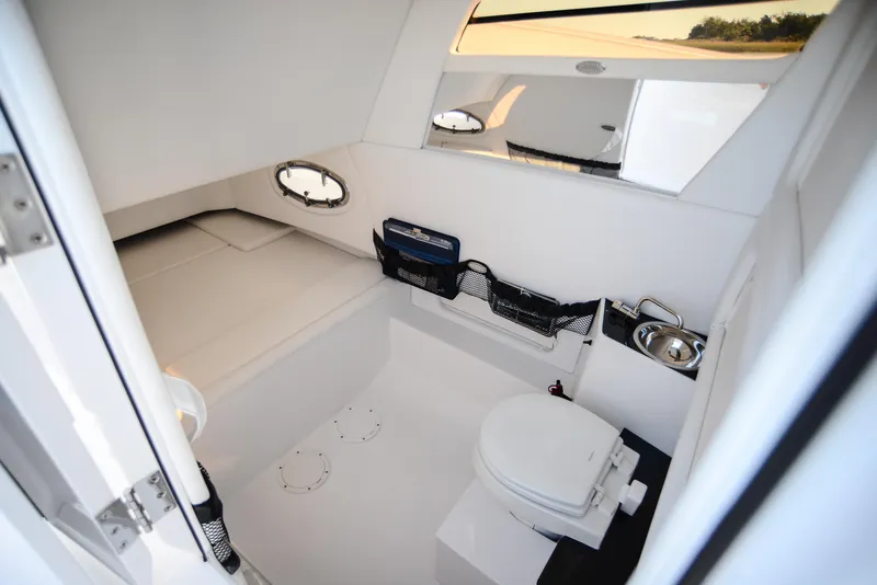 Slide: The Image of 2025 Nor-Tech 340 boat interior with toilet and sink. - 25