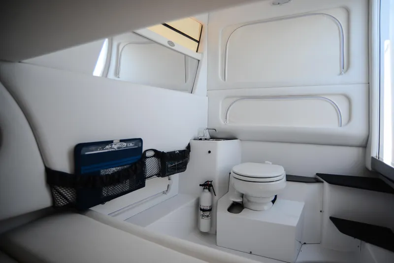 Slide: The Image of Luxurious Nor-Tech 340 boat interior bathroom, 2025 model, featuring modern amenities and sleek design. - 27