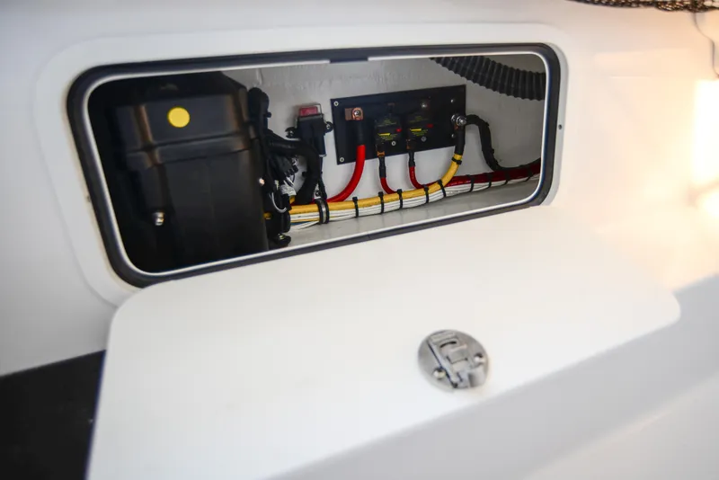 Slide: The Image of Electrical compartment of 2025 Nor-Tech 340 boat, showcasing wiring and components. - 31
