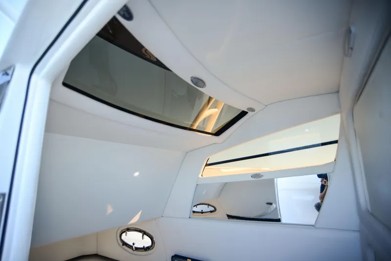 Slide: The Image of Interior view of 2025 Nor-Tech 340 boat cabin with skylights and modern design. - 33