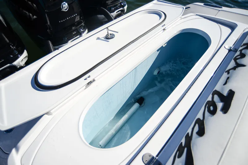 Slide: The Image of Livewell on 2025 Nor-Tech 340 boat, open lid, filled with water. - 43