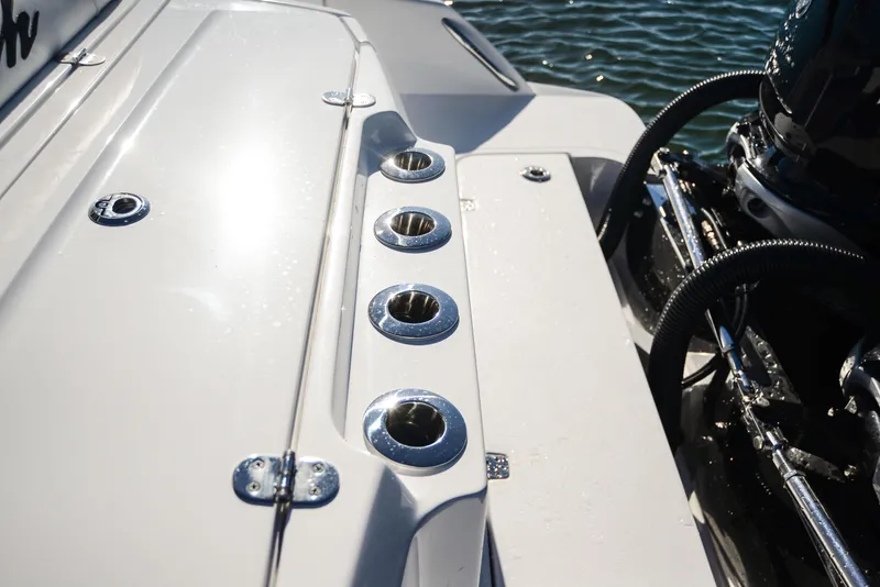 Slide: The Image of Nor-Tech 340 boat deck, 2025 model, with chrome fittings and engine detail. - 44