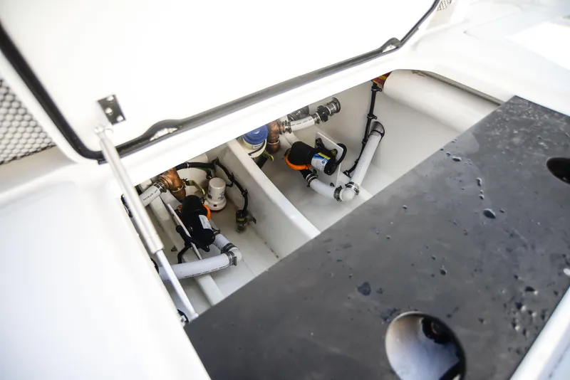 Slide: The Image of Open engine compartment of 2025 Nor-Tech 340 boat, showcasing internal components and wiring. - 49