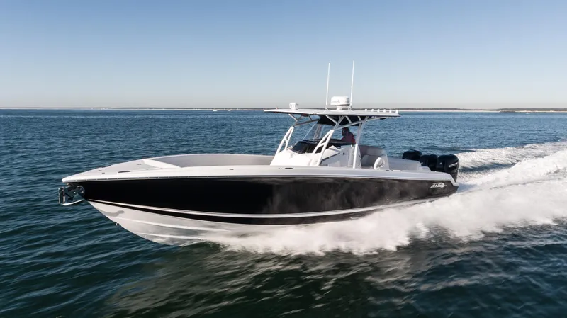 Slide: The Image of 2025 Nor-Tech 340 boat cruising on open water, showcasing sleek design and powerful performance. - 9