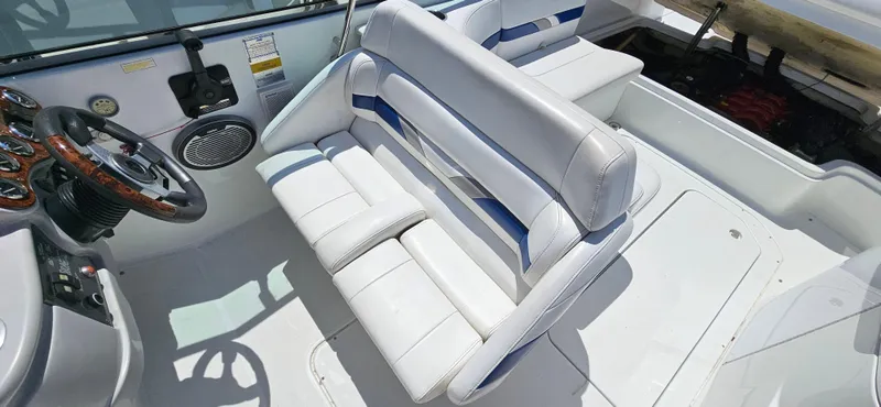 Slide: The Image of 2004 Formula 260 Bowrider interior with white seating and steering wheel. - 12
