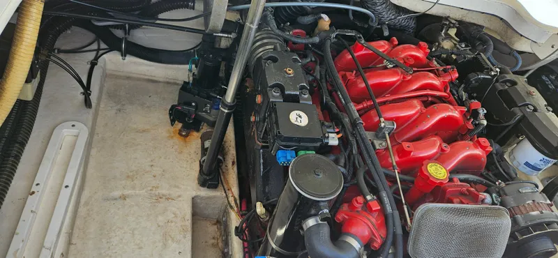 Slide: The Image of 2004 Formula 260 Bowrider engine compartment with red engine components. - 14