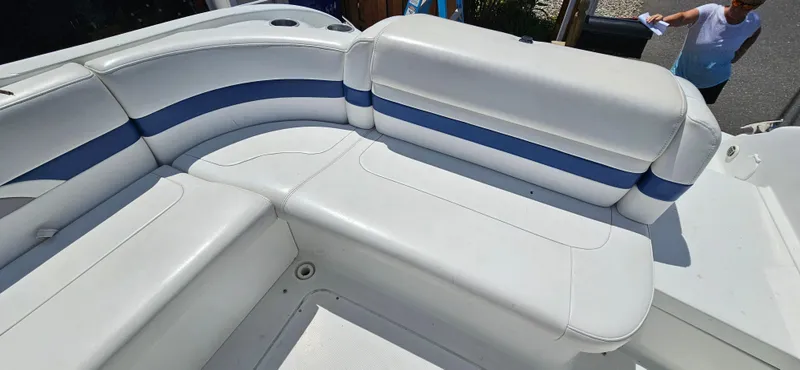 Slide: The Image of 2004 Formula 260 Bowrider boat with white and blue seating. - 19