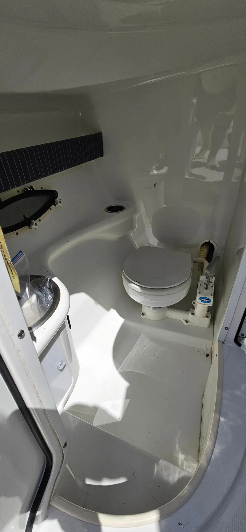 Slide: The Image of 2004 Formula 260 Bowrider boat bathroom interior with toilet and sink. - 20