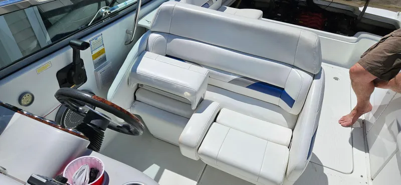 Slide: The Image of 2004 Formula 260 Bowrider interior with white seating and steering wheel. - 4
