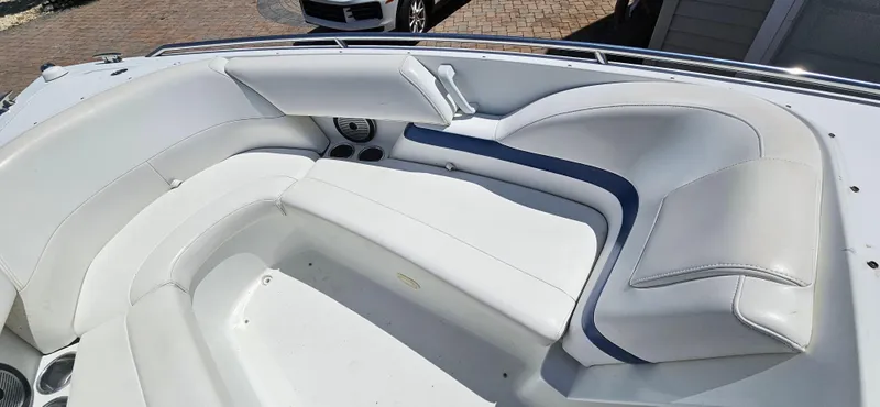 Slide: The Image of 2004 Formula 260 Bowrider boat interior with white and blue seating. - 6