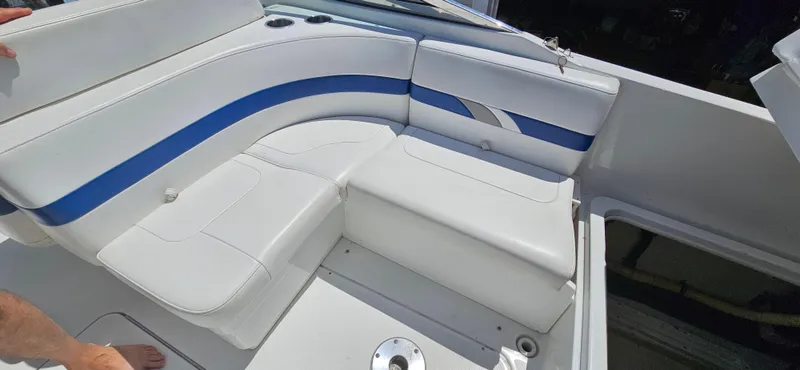 Slide: The Image of 2004 Formula 260 Bowrider boat interior with white and blue seating. - 9