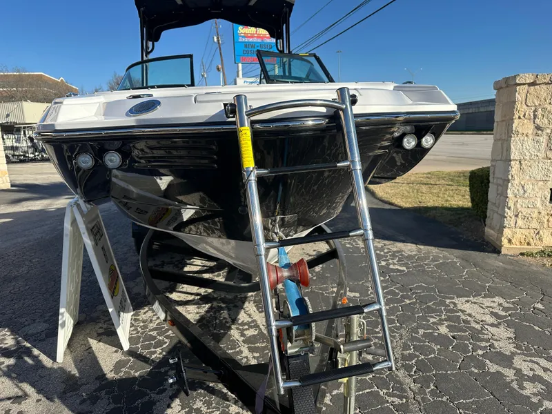 Slide: The Image of 2025 Monterey M-45 boat with ladder, displayed outdoors on a sunny day. - 10