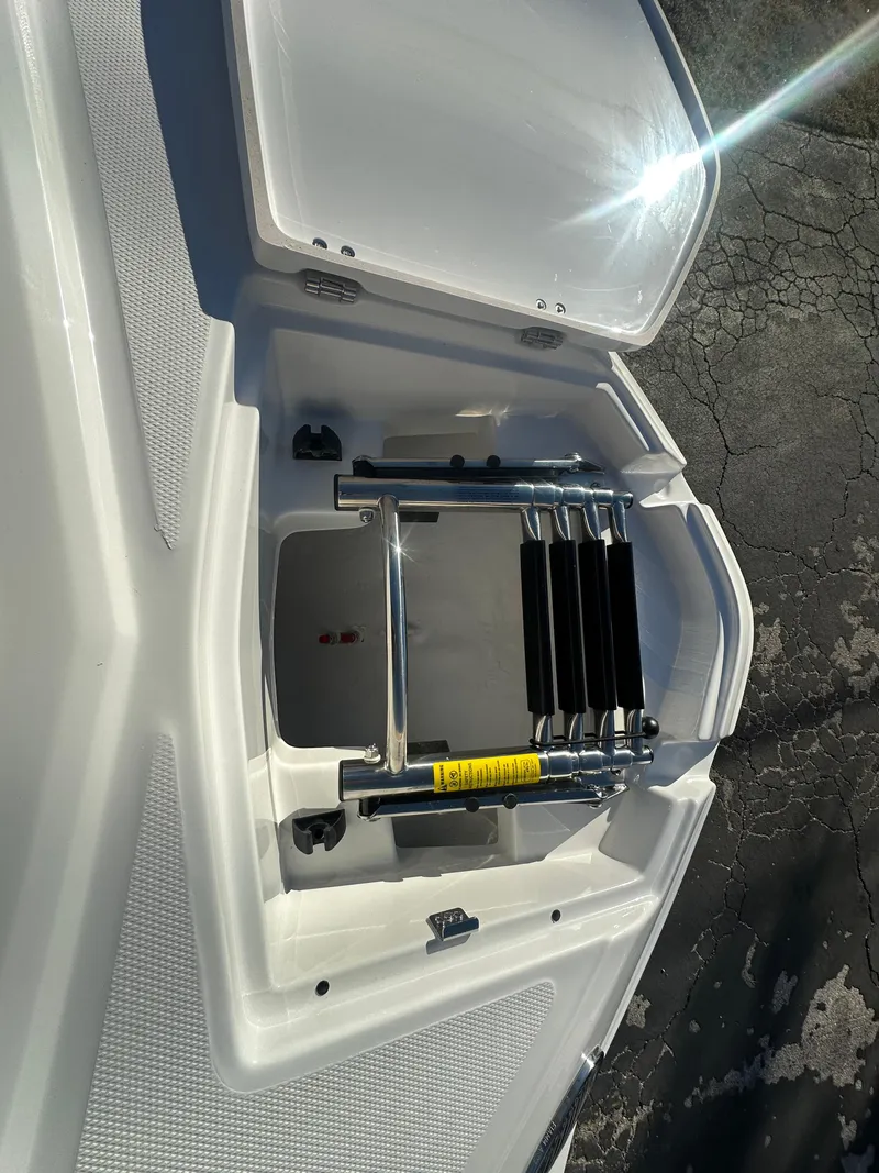 Slide: The Image of 2025 Monterey M-45 boat with open storage compartment and retractable ladder. - 19