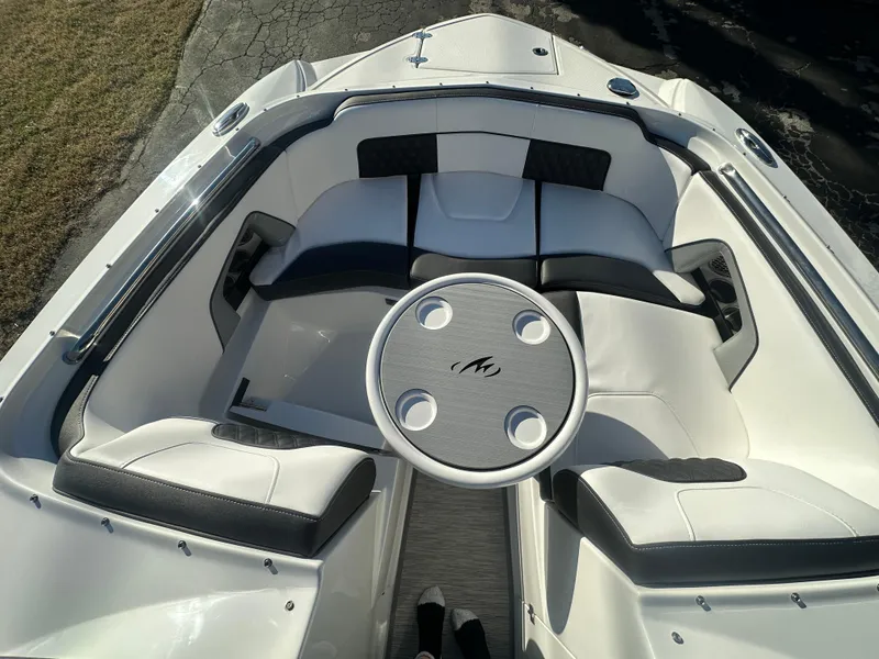 Slide: The Image of 2025 Monterey M-45 boat interior with white seating and round table. - 22