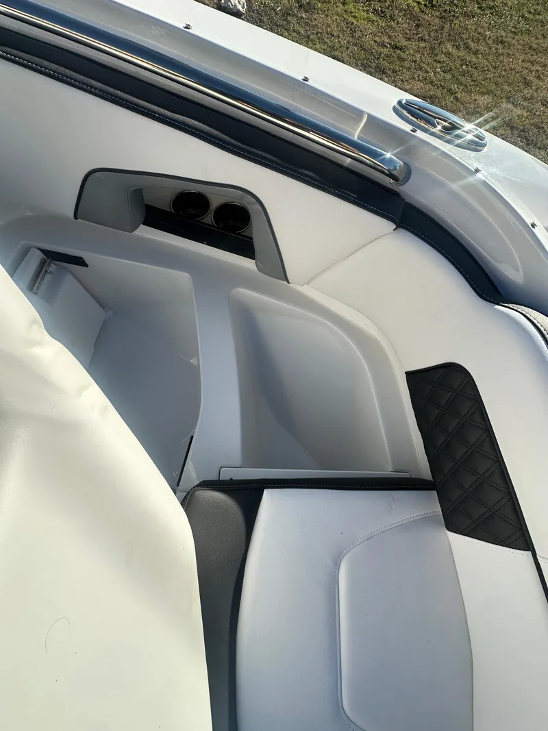 Slide: The Image of Interior of 2025 Monterey M-45 boat, featuring sleek white seating and modern design elements. - 24