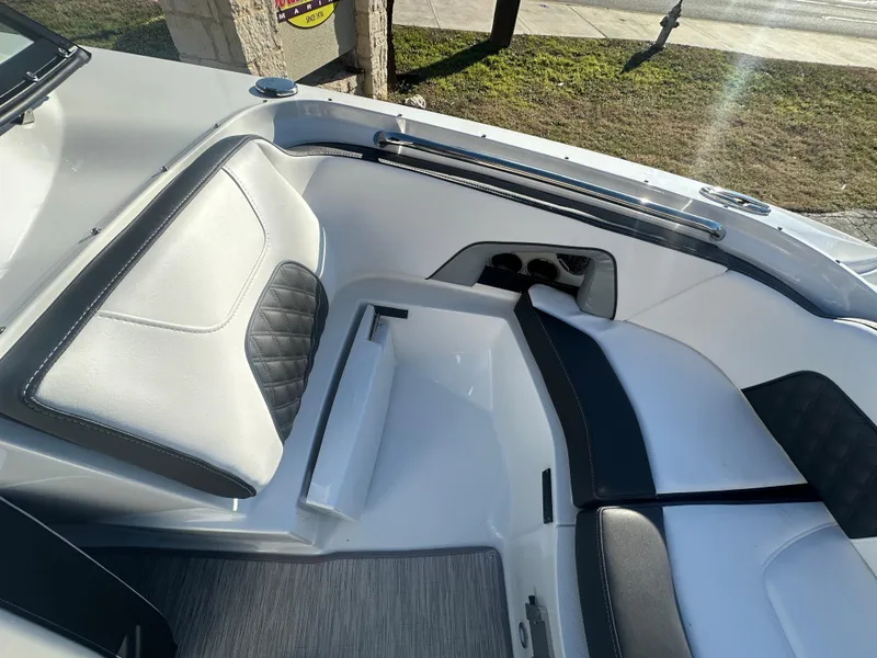 Slide: The Image of Interior of 2025 Monterey M-45 boat with sleek white and black seating. - 25