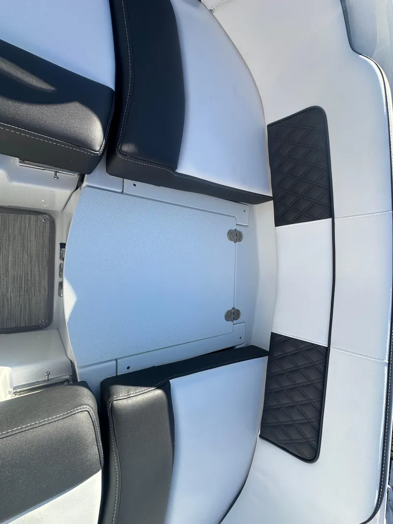 Slide: The Image of Interior seating of 2025 Monterey M-45 boat with black and white upholstery. - 28