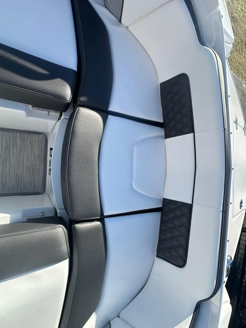 Slide: The Image of 2025 Monterey M-45 boat interior with black and white seating. - 29