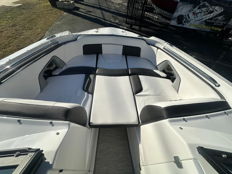 Slide: The Image of 2025 Monterey M-45 boat interior with sleek white and black seating design. - 30
