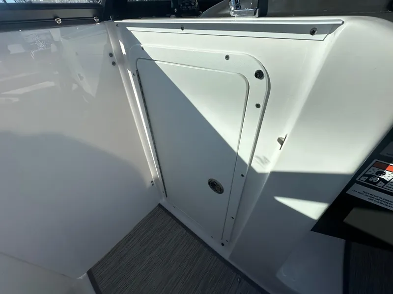 Slide: The Image of 2025 Monterey M-45 boat interior with storage compartment and sleek design. - 32