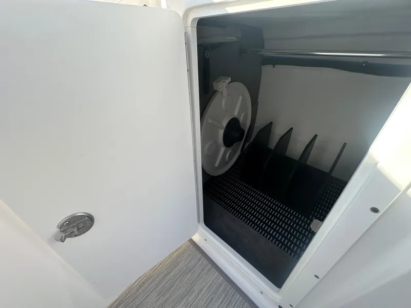 Slide: The Image of 2025 Monterey M-45 storage compartment with open door, showcasing interior features and design. - 33