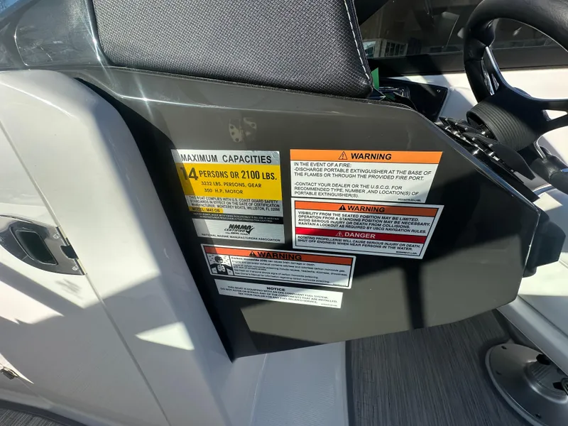 Slide: The Image of Control panel of 2025 Monterey M-45 boat with safety and capacity warning labels. - 36