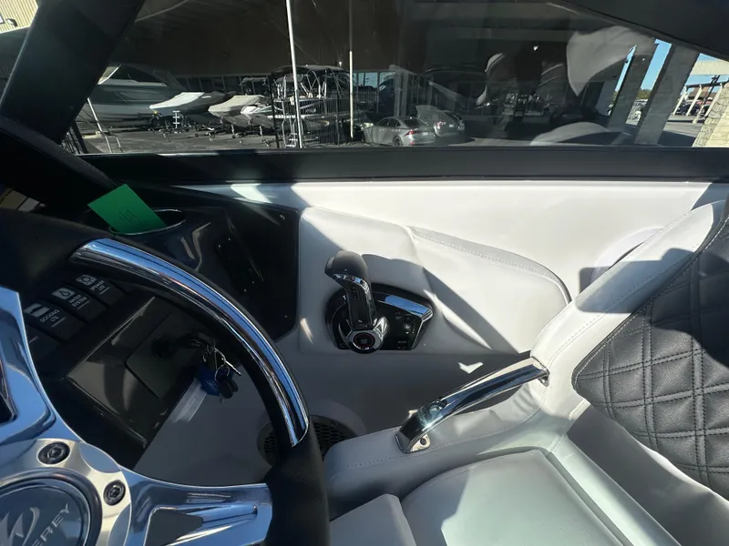 Slide: The Image of Interior of 2025 Monterey M-45 boat, featuring sleek steering and modern controls. - 40