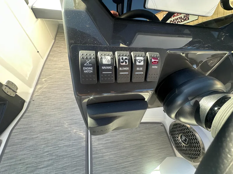 Slide: The Image of Control panel of a 2025 Monterey M-45 boat with labeled switches. - 43