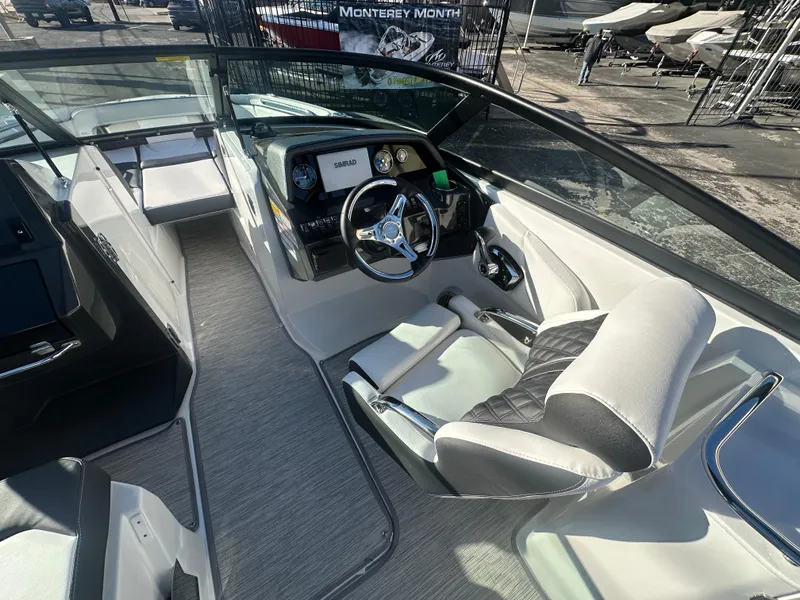 Slide: The Image of 2025 Monterey M-45 boat interior with modern steering and seating. - 44