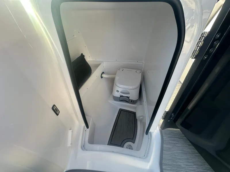 Slide: The Image of Compact bathroom in 2025 Monterey M-45 boat, featuring a modern portable toilet. - 45