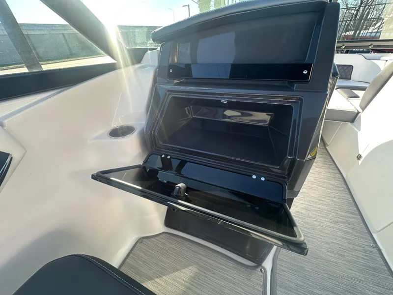 Slide: The Image of 2025 Monterey M-45 boat interior with open storage compartment, sleek design, and modern features. - 46