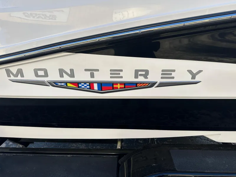 Slide: The Image of 2025 Monterey M-45 boat logo with nautical flag design. - 6