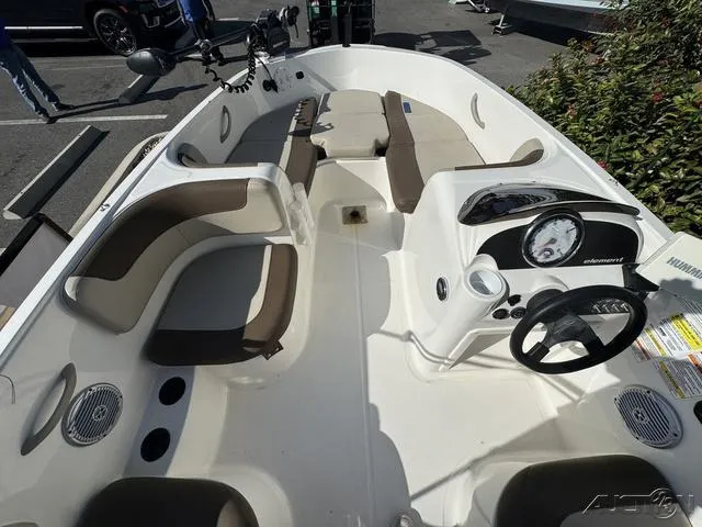 Slide: The Image of 2014 Bayliner 160 Bowrider interior with seating and steering console. - 18