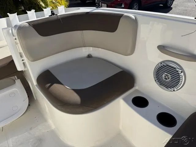 Slide: The Image of 2014 Bayliner 160 Bowrider interior seating with cup holders and speaker. - 25