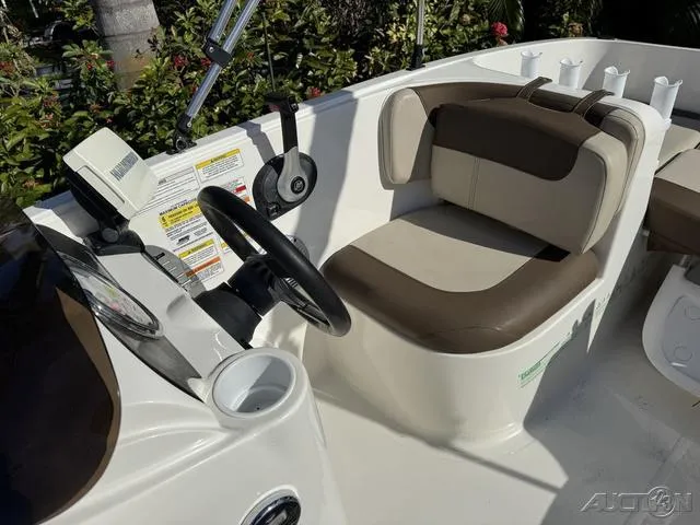 Slide: The Image of 2014 Bayliner 160 Bowrider interior with steering wheel and seating. - 26