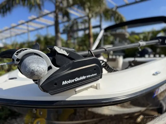 Slide: The Image of 2014 Bayliner 160 Bowrider with MotorGuide Wireless trolling motor, outdoors. - 3