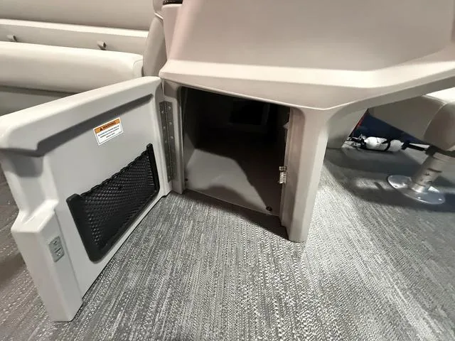 Slide: The Image of Open storage compartment in 2025 Godfrey Pontoons Xperience 2286 FSX boat interior. - 13