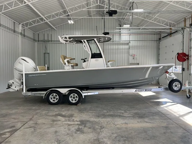 The Image of 2025 Sportsman MASTERS 247OE boat in a garage, on a trailer. - 1