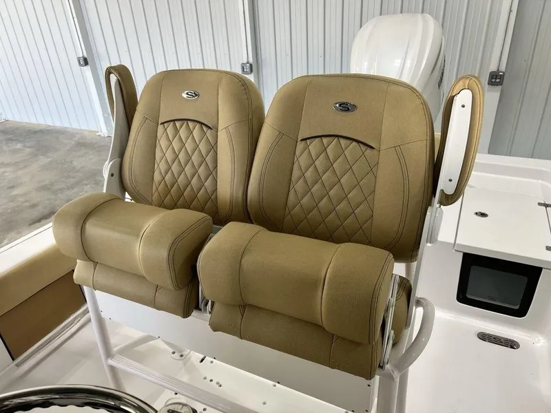 Slide: The Image of 2025 Sportsman Masters 247OE Bay Boat dashboard with steering wheel and controls. - 13