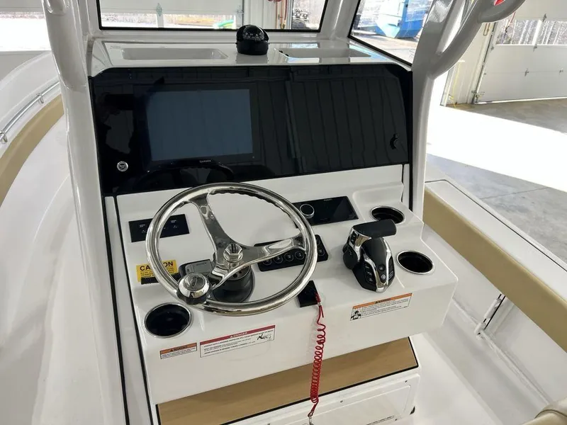 Slide: The Image of 2025 Sportsman Masters 247OE Bay Boat dashboard with Garmin display. - 15