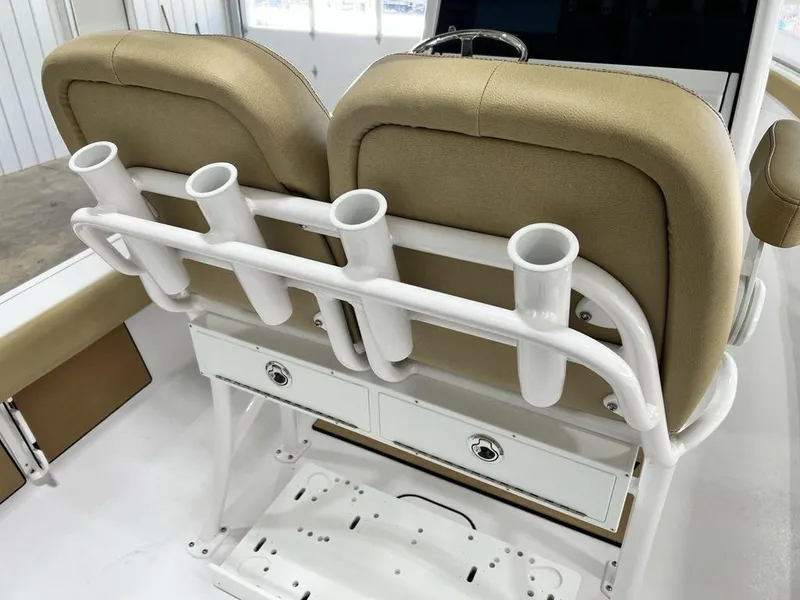 Slide: The Image of 2025 Sportsman Masters 247OE Bay Boat dashboard with compass and storage compartments. - 21