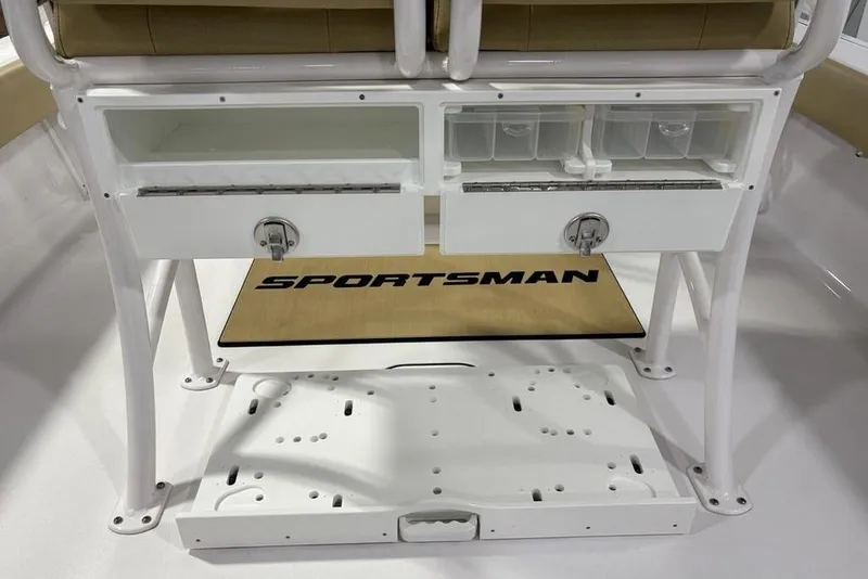 Slide: The Image of 2025 Sportsman Masters 247OE Bay Boat interior with rod holders and storage drawers. - 31